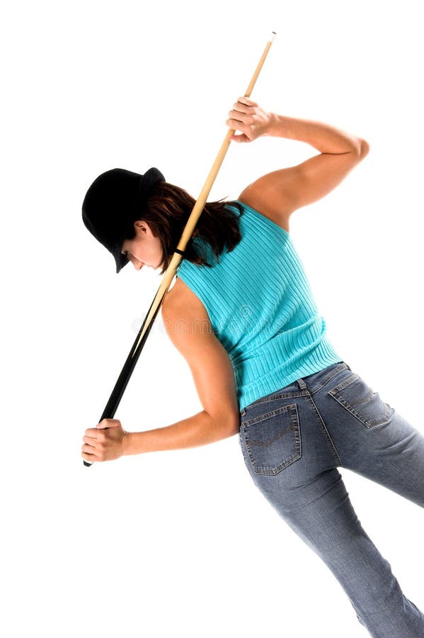 young woman in jeans and a hat with a pool cue. young woman in jeans and a hat with a pool cue
