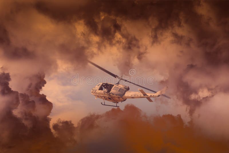 A Rescue Helicopter races against an oncoming Storm severe weather,Modern attack helicopter with with weapons