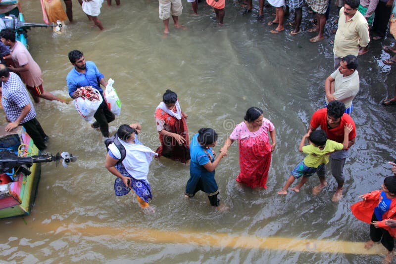 Rescue team help people to escape from flooded area royalty free stock photo Rescue team help people to escape from flooded area royalty free stock photo