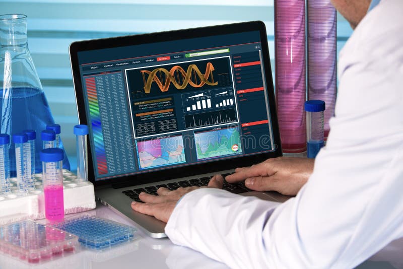 Research geneticist using computer biotechnology lab stock image