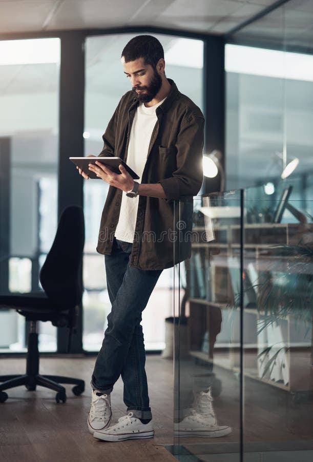 Research, tablet and reading with business man in office for schedule, planning and editor feedback. Idea, author royalty free stock image