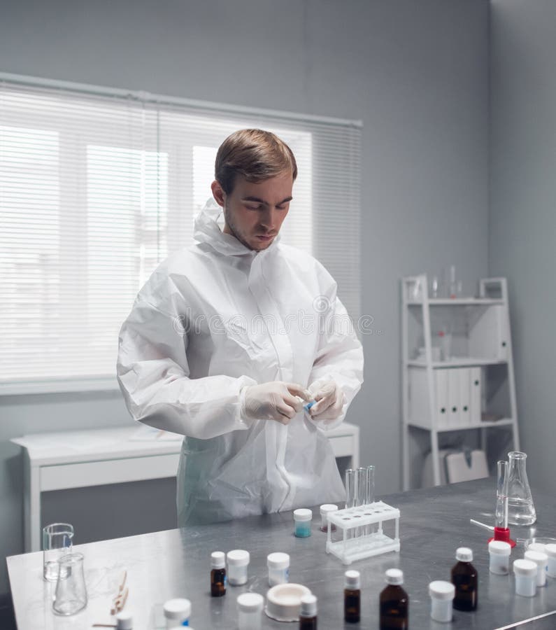 A Researcher Doing a Chemical Test in the Laboratory, Mixing Some