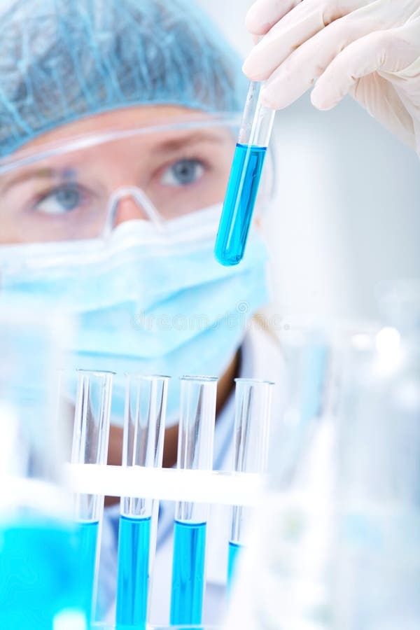 Researcher working with chemicals stock images