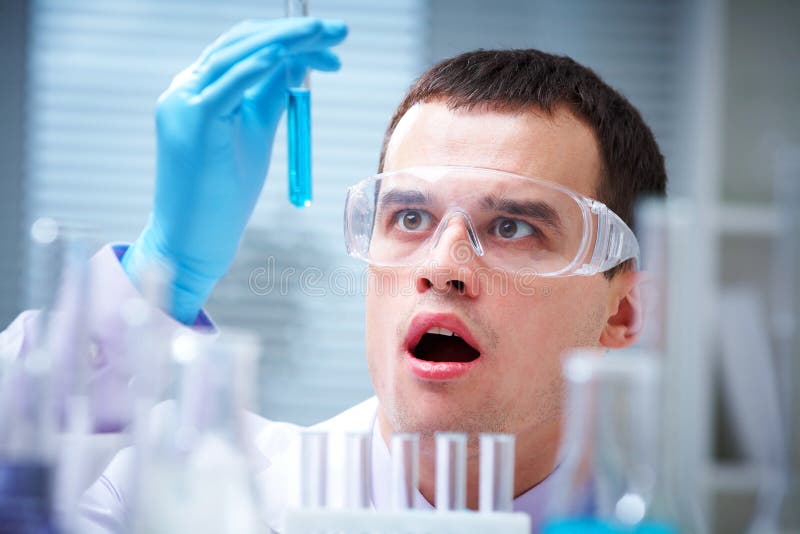 Researcher working with chemicals stock images