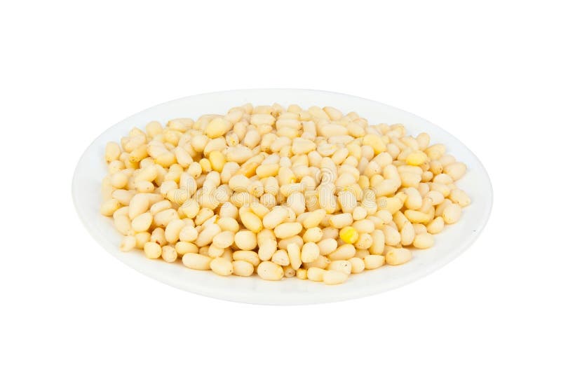 Resh peeled pine nuts on white royalty free stock photo