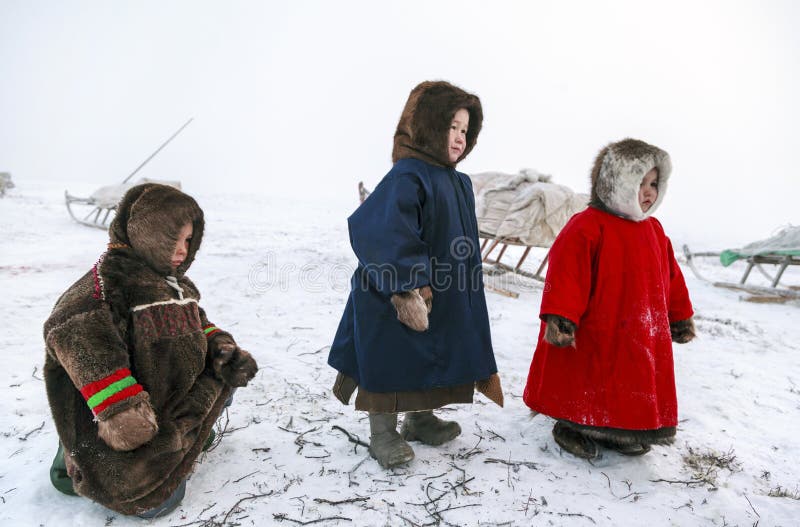 A resident of the tundra, indigenous residents of the Far North, tundra, open area, children ride on sledges, children  in