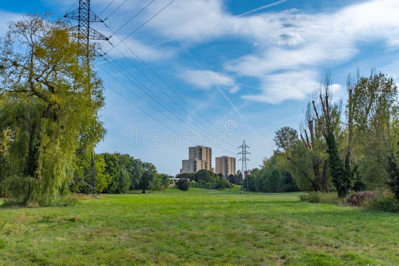 Residential tower and pylons in a green suburb stock photo Residential tower and pylons in a green suburb stock photo