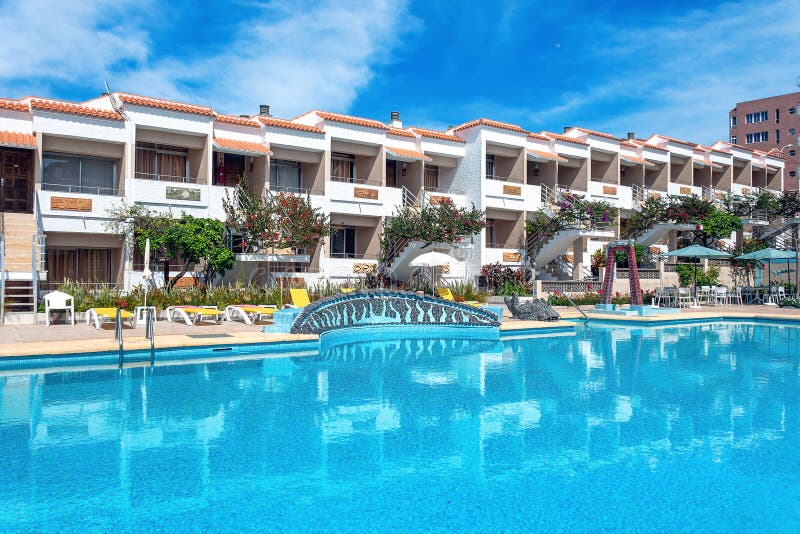 Resort hotel with swimming pool with a blue sky day in Tenerife. Canary Islands