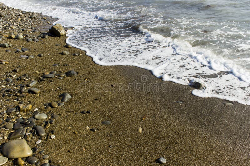 Ressac de mer sur la plage photo stock Ressac de mer sur la plage photo stock