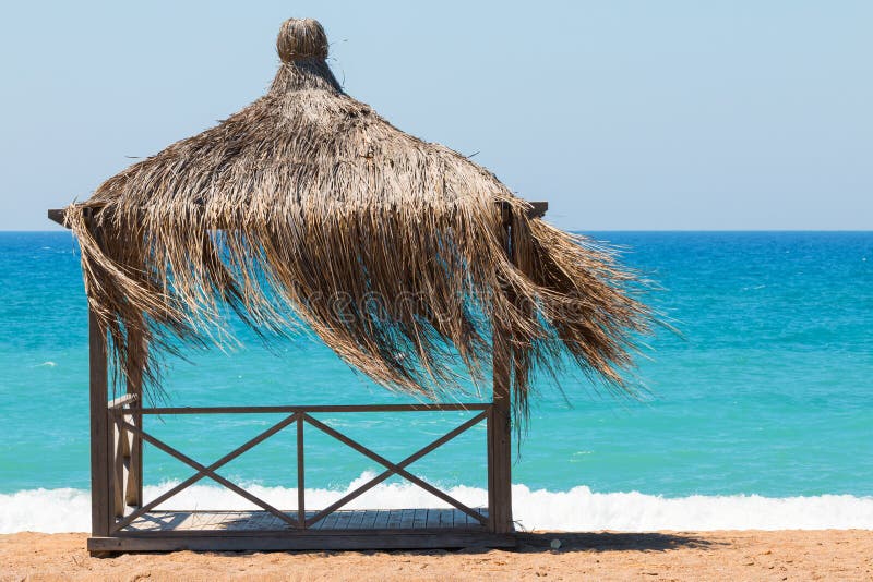 Rest shack on tropical beach on the shore of the ocean