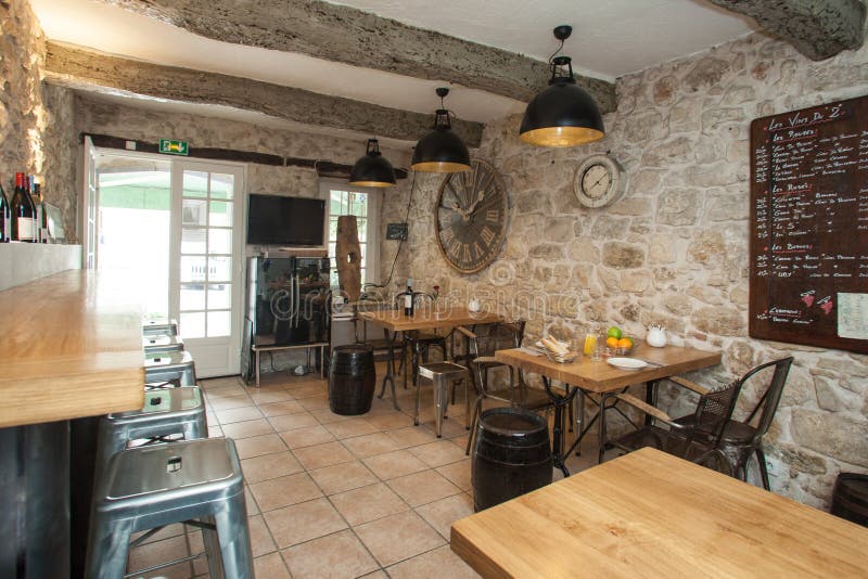 Interior of French bistro with rustic furniture. Interior of French bistro with rustic furniture.