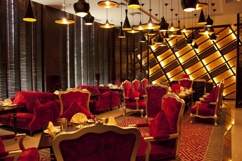 Red sofa with soft lighting and romantic European-style chair back restaurant
