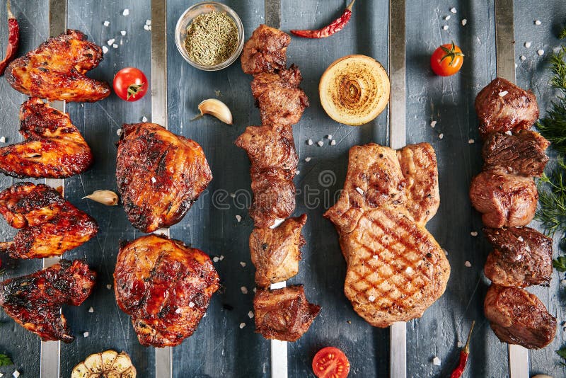 premiun quality beef, Chiken and pork on stones with french fries