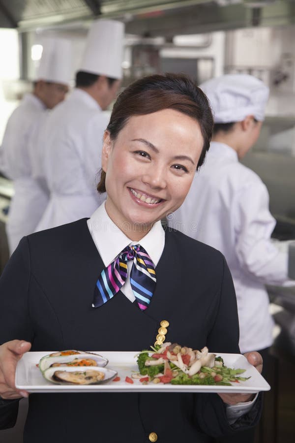 Restaurant Hostess Presenting Gourmet Dish Stock Image Image of 5559