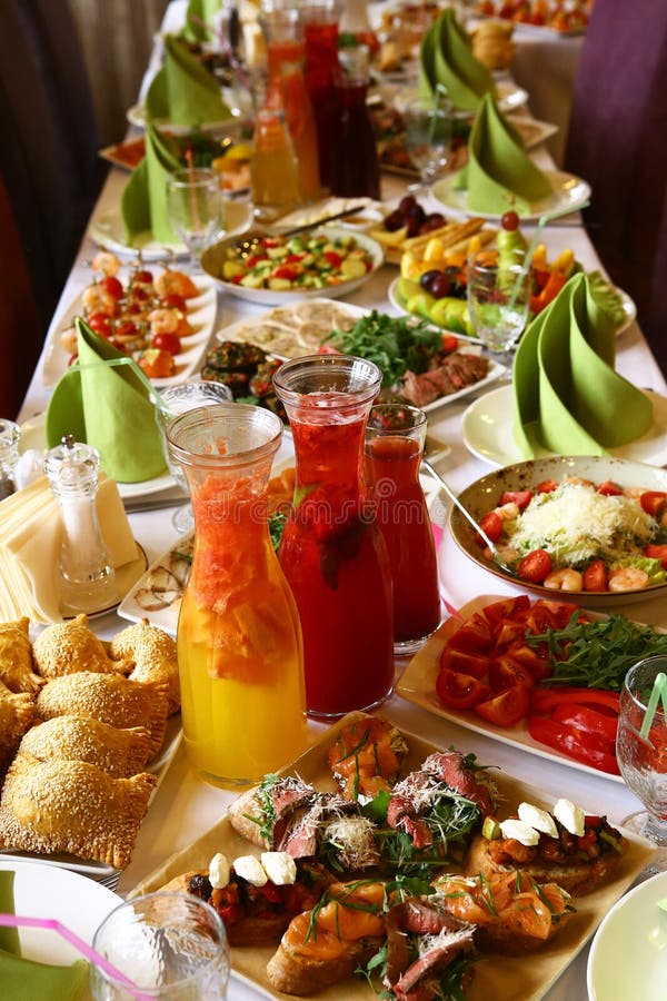 Restaurant long table served with snack food drink