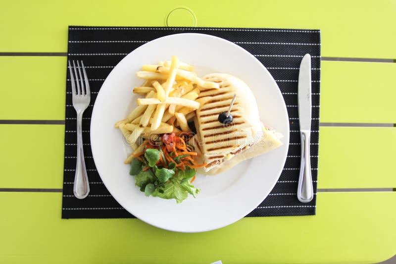 French fries with bread and salad. Table setting in a restaurant royalty free stock image French fries with bread and salad. Table setting in a restaurant royalty free stock image