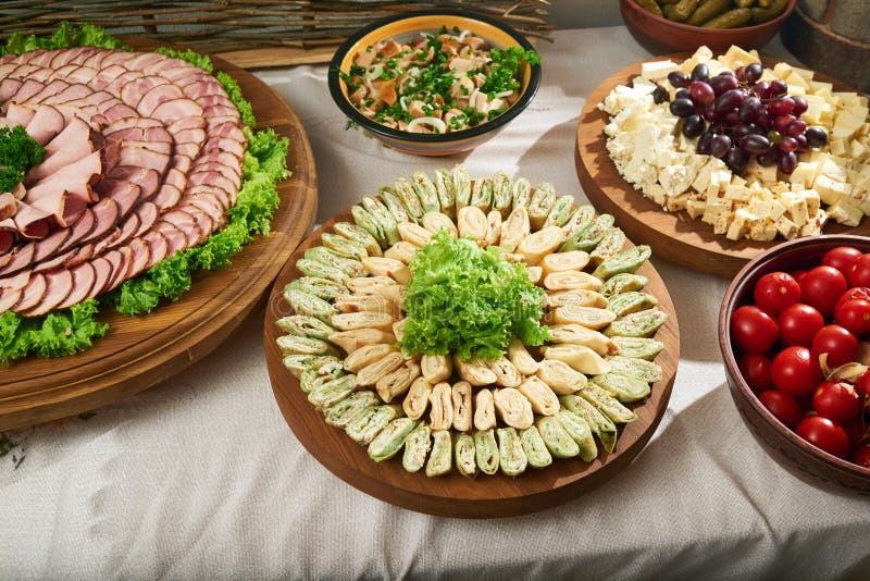 Party Brunch big Buffet table setting with Food Meat Vegetables Stock Photo  - Alamy