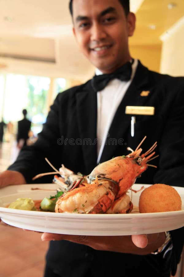 Restaurant waiter holding food