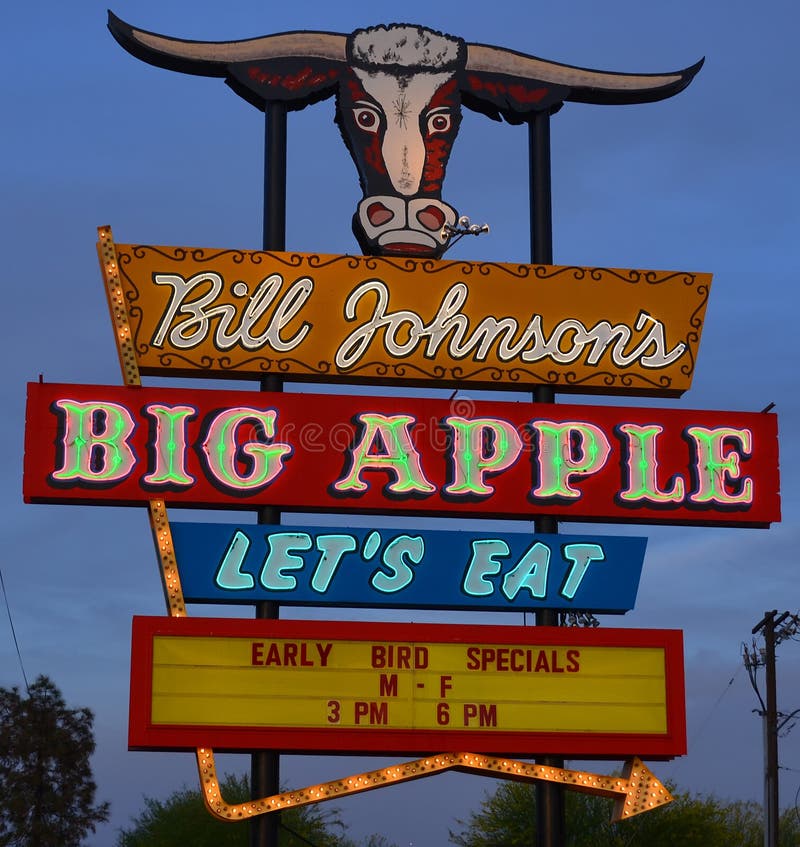 PHOENIX ARIZONA APRIL 25 2014: Typical South west restaurant steak house sign of Bill Johnson's Big Apple stuck around long enough to become part of town's history offers breakfast, lunch, and dinner. PHOENIX ARIZONA APRIL 25 2014: Typical South west restaurant steak house sign of Bill Johnson's Big Apple stuck around long enough to become part of town's history offers breakfast, lunch, and dinner.