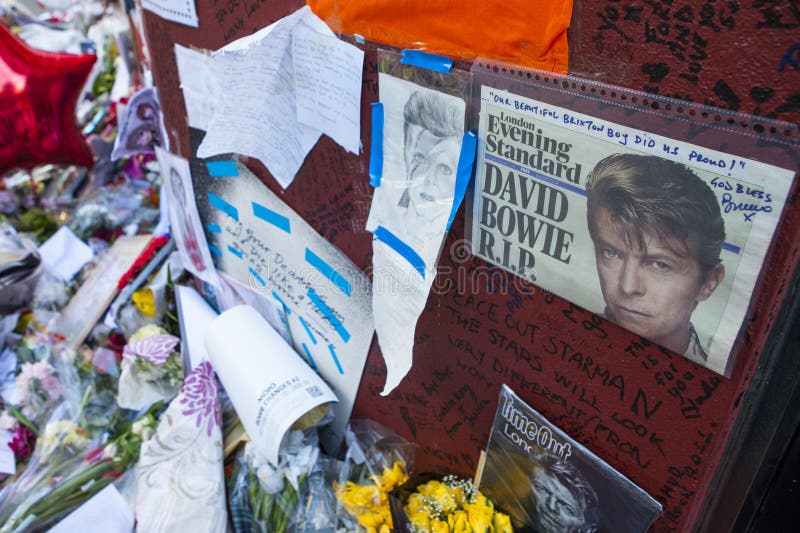 LONDON, UK - JANUARY 21ST 2016: Messages from fans at the David Bowie mural in Brixton, South London, on 20th January 2016. LONDON, UK - JANUARY 21ST 2016: Messages from fans at the David Bowie mural in Brixton, South London, on 20th January 2016.