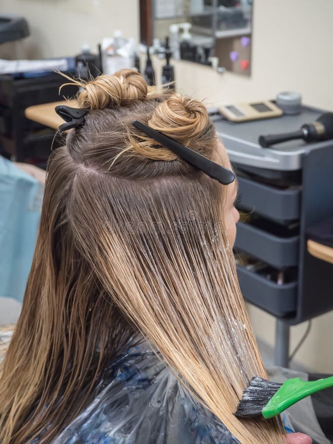 Restoration of damaged hair with innovative materials. Female holding messy unbrushed dry hair stock images, royalty-free photos and pictures