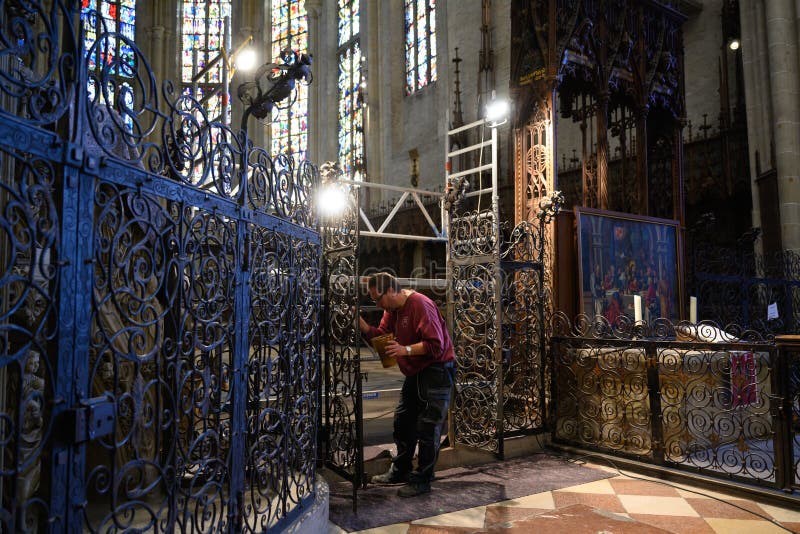 Conservator working inside historic Ulm Minster - Ulmer Muenster - Baden-Wuerttemberg, Germany