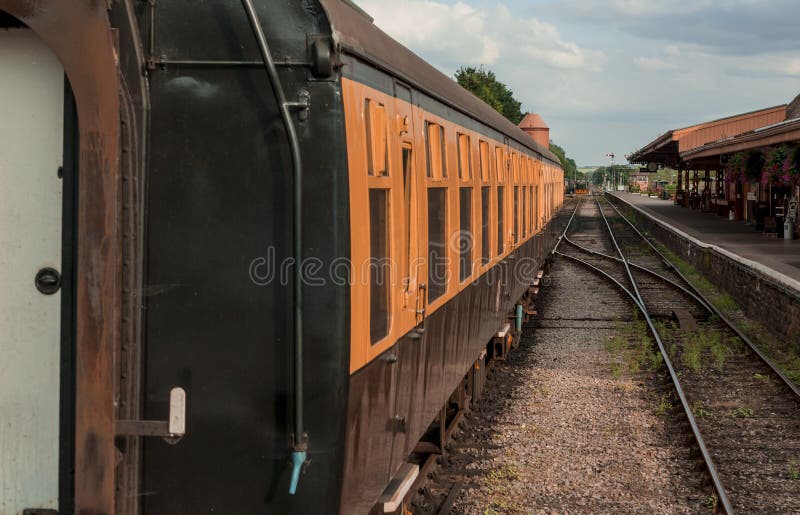 Restored VictorianEra Passenger Rail Train at a Train Station Stock