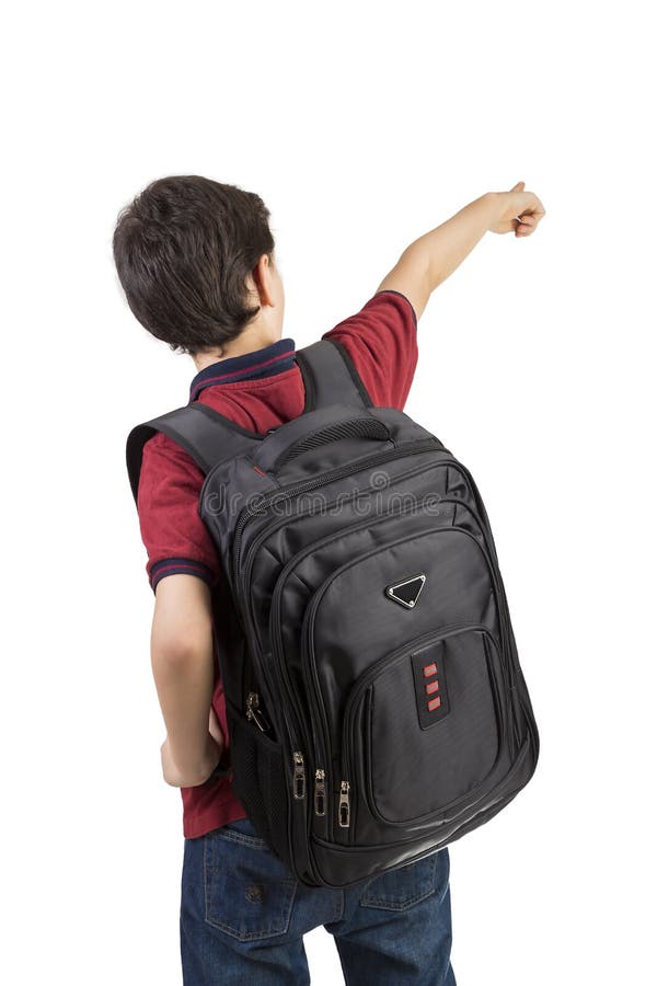 Retour à l'école - Vue arrière d'un écolier avec un sac à dos pointant vers l'école photographie stock libre de droits