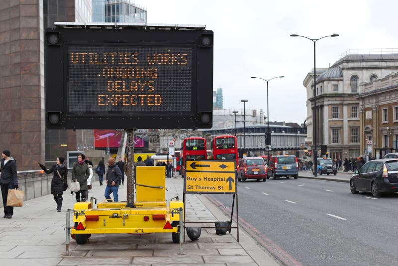 LONDON, UNITED KINGDOM - JANUARY 25: Delays Expected traffic info board in London on JANUARY 25, 2013. Portable Variable Message Sign at Southwark in London, United Kingdom. LONDON, UNITED KINGDOM - JANUARY 25: Delays Expected traffic info board in London on JANUARY 25, 2013. Portable Variable Message Sign at Southwark in London, United Kingdom.