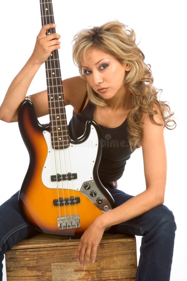 Portrait of Girl sitting on the box with bass guitar. Portrait of Girl sitting on the box with bass guitar