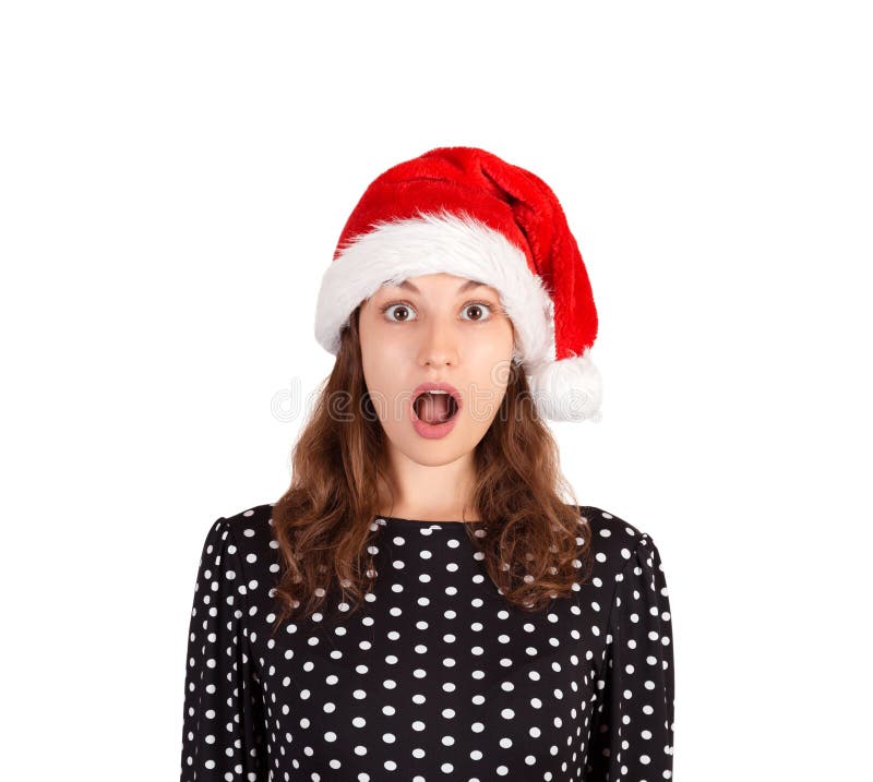 Retrato da mulher chocada e surpreendida expressivo menina emocional no chapéu do Natal de Papai Noel isolado no fundo branco Hol fotos de stock royalty free Retrato da mulher chocada e surpreendida expressivo menina emocional no chapéu do Natal de Papai Noel isolado no fundo branco Hol fotos de stock royalty free