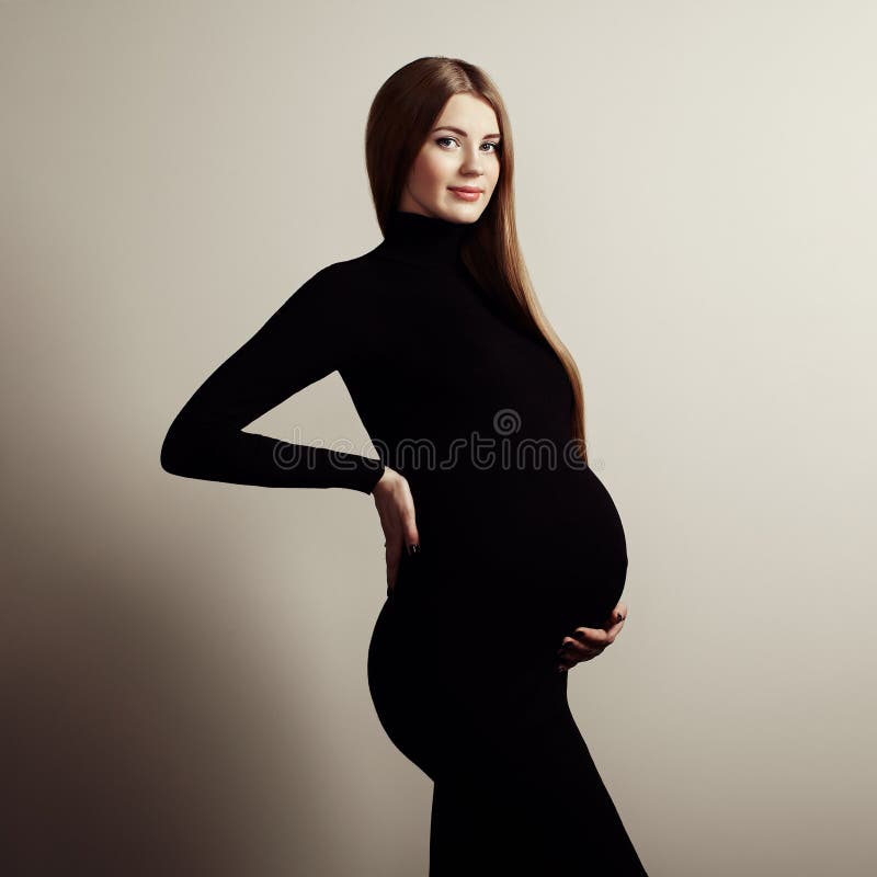 Retrato da mulher gravida nova imagem de stock Retrato da mulher gravida nova imagem de stock