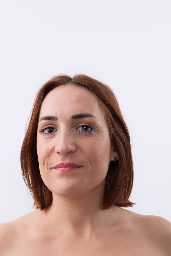 Portrait of 30 years old beautiful woman, caucasian with short red hair looking at smiling camera isolated on white background. Natural beauty concept. Portrait of 30 years old beautiful woman, caucasian with short red hair looking at smiling camera isolated on white background. Natural beauty concept