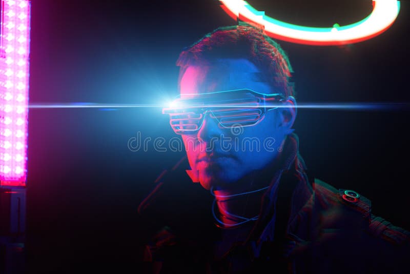 Cyberpunk style portrait of man in futuristic costume. Image with glitch effect. Concept of augmented and virtual reality, game, future technology. Cyberpunk style portrait of man in futuristic costume. Image with glitch effect. Concept of augmented and virtual reality, game, future technology.