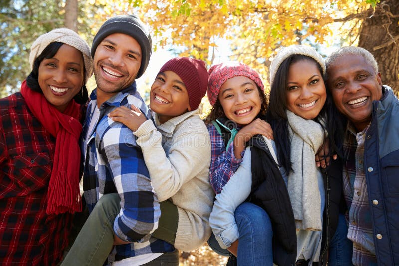 Portrait Of Extended Family On Walk Through Woods In Fall. Portrait Of Extended Family On Walk Through Woods In Fall