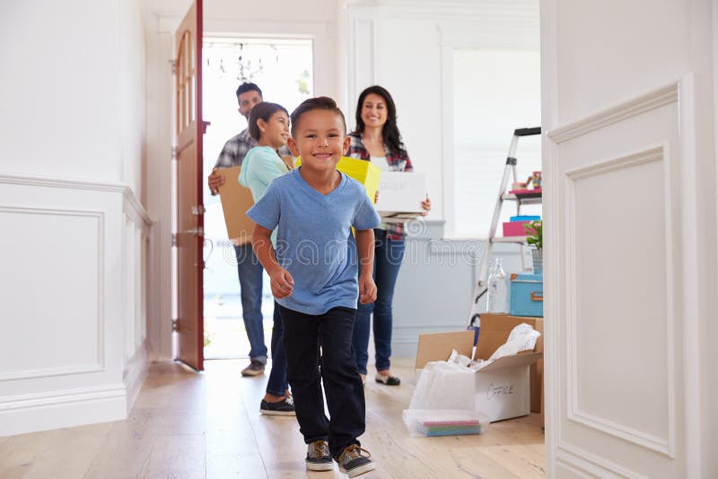 Portrait Of Hispanic Family Moving Into New Home. Portrait Of Hispanic Family Moving Into New Home