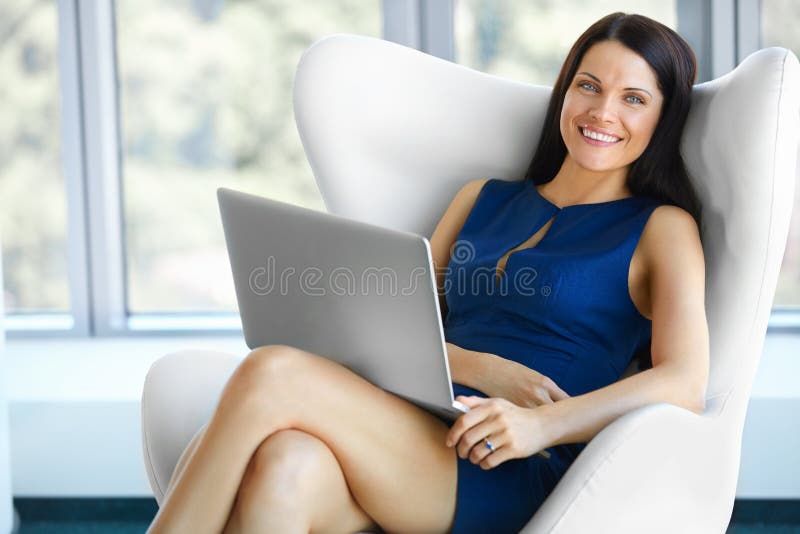 Portrait of relaxed business woman in office. Relax and freedom concept. Portrait of relaxed business woman in office. Relax and freedom concept.