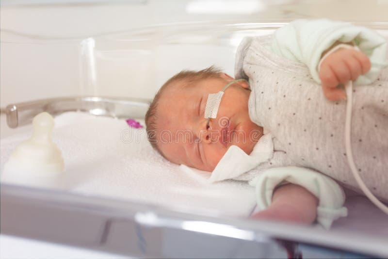 Sleeping premature newborn child in ICU unit in hospital. Sleeping premature newborn child in ICU unit in hospital