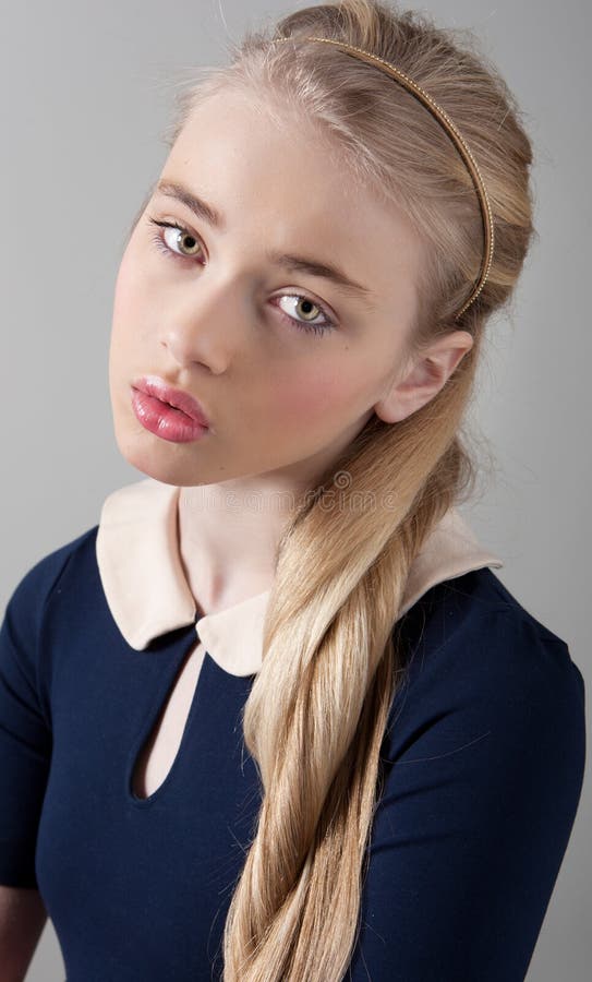 Portrait of a beautiful teenager girl with fair skin and make up in studio. Portrait of a beautiful teenager girl with fair skin and make up in studio