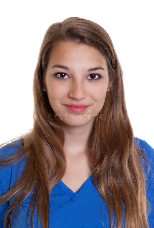 Retrato de una mujer sonriente en una camisa azul fotografía de archivo Retrato de una mujer sonriente en una camisa azul fotografía de archivo