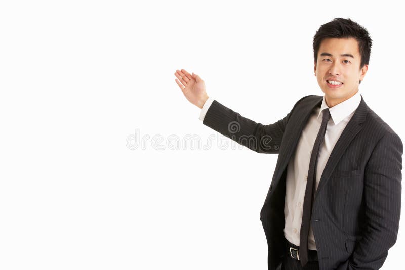 Studio Portrait Of Chinese Businessman Gesturing Smiling. Studio Portrait Of Chinese Businessman Gesturing Smiling