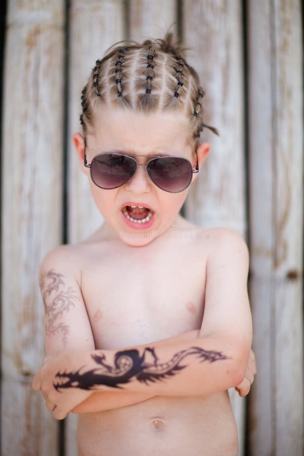 Cute 5 years old boy with african style hair and henna tattoo. Cute 5 years old boy with african style hair and henna tattoo