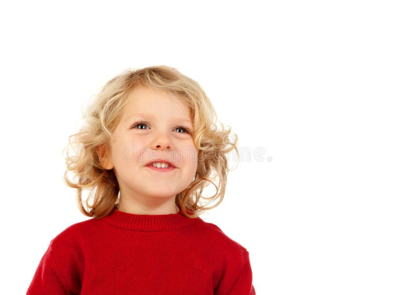 Retrato del pequeño niño juguetón con el pelo rubio largo que mira para arriba fotos de archivo libres de regalías Retrato del pequeño niño juguetón con el pelo rubio largo que mira para arriba fotos de archivo libres de regalías