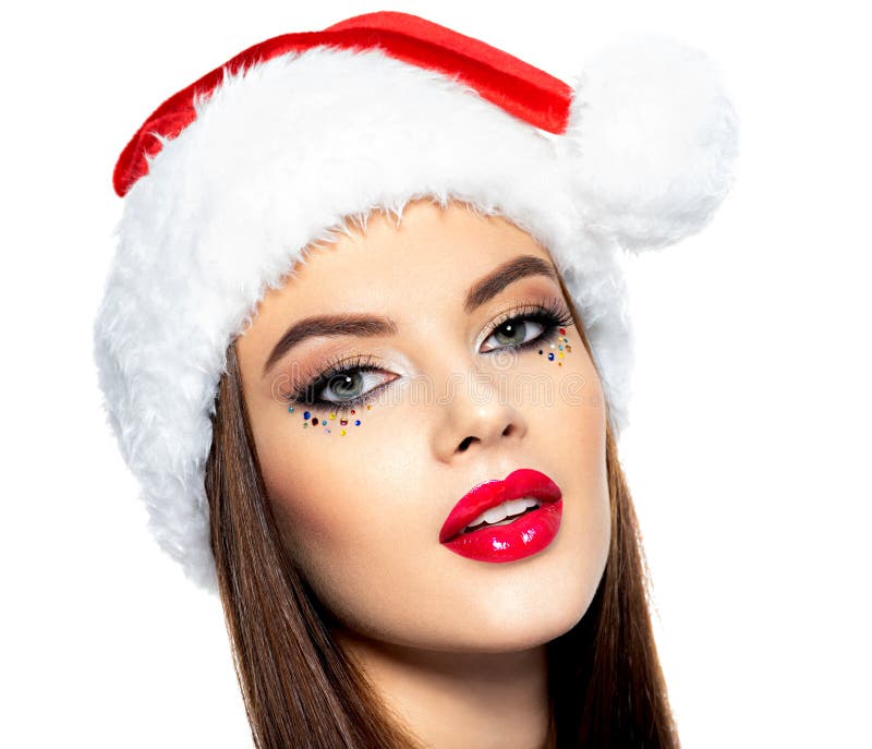 Retrato del primer de la mujer en un sombrero de santa La cara de la mujer hermosa con maquillaje creativo brillante fotos de archivo libres de regalías Retrato del primer de la mujer en un sombrero de santa La cara de la mujer hermosa con maquillaje creativo brillante fotos de archivo libres de regalías