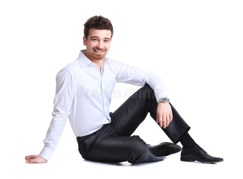 Retrato do homem de negócio que senta-se no assoalho imagem de stock Retrato do homem de negócio que senta-se no assoalho imagem de stock