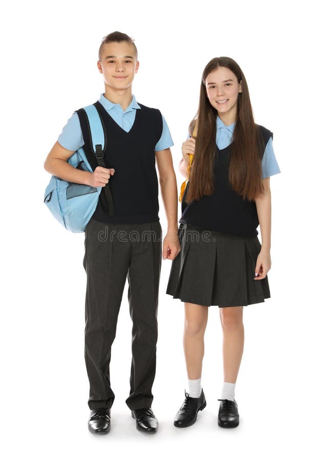 Retrato integral de adolescentes en uniforme escolar con las mochilas en blanco imágenes de archivo libres de regalías Retrato integral de adolescentes en uniforme escolar con las mochilas en blanco imágenes de archivo libres de regalías