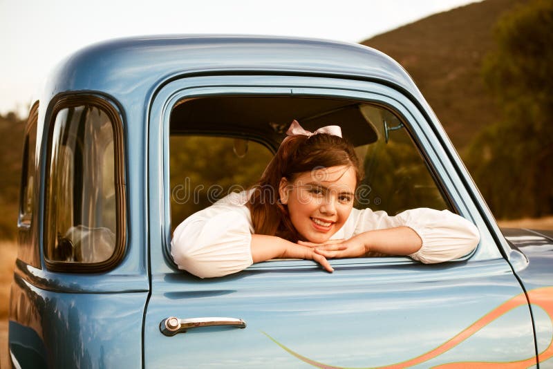 Retro 1950s teen in classic blue truck royalty free stock photos Retro 1950s teen in classic blue truck royalty free stock photos