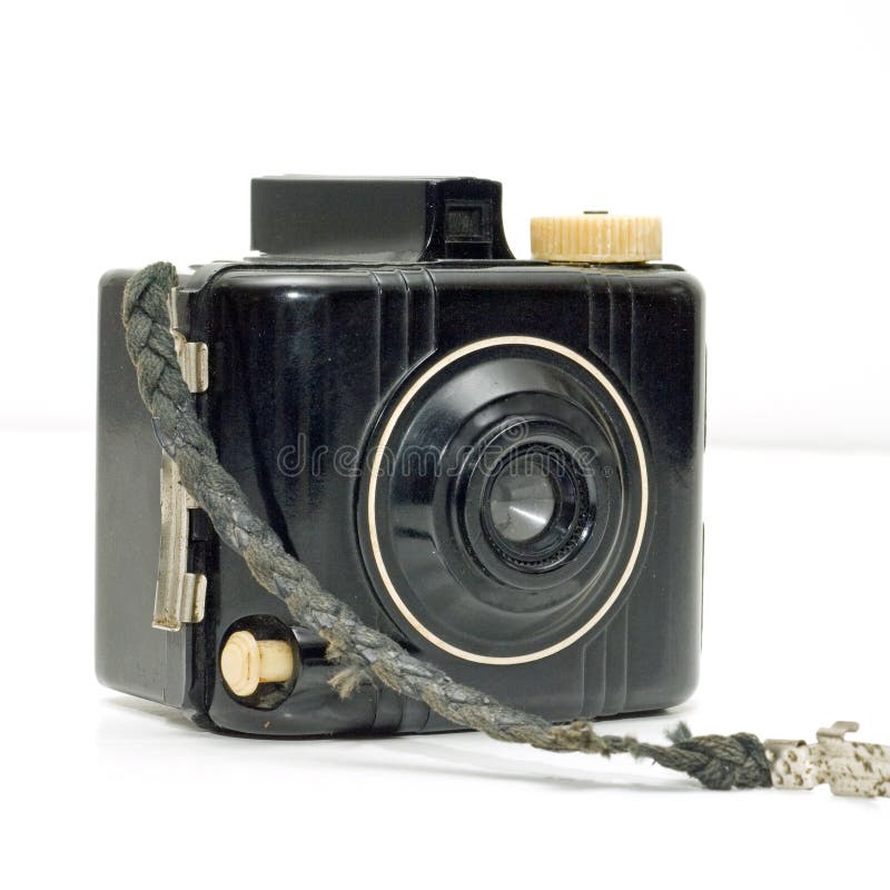 Symmetric and geometric style Retro art deco special edition baby brownie with cord brown bakelite body on white background with plastic lens and viewfinder and light brown tan shutter release button and metal side clasp to open body. Button clasp stock images, royalty-free photos and pictures
