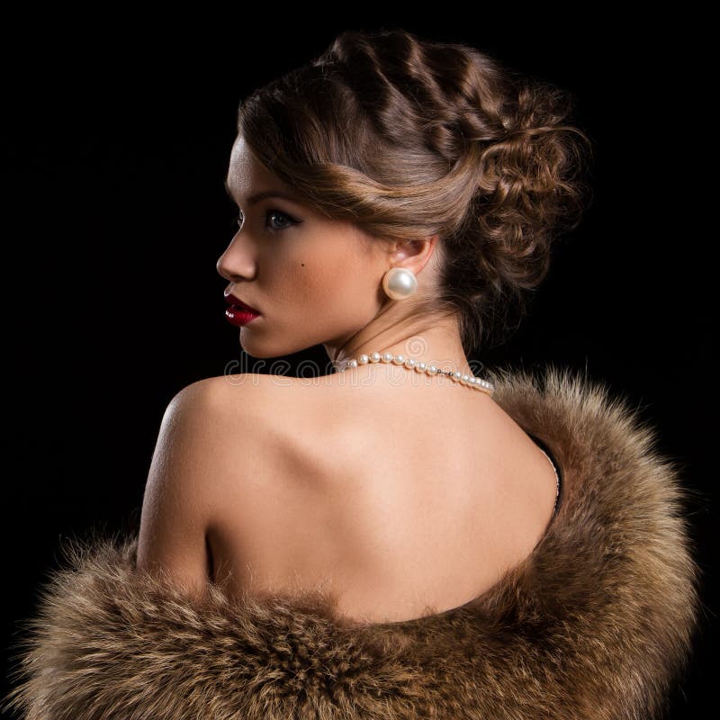 Retro. Beautiful, attractive woman wearing fur