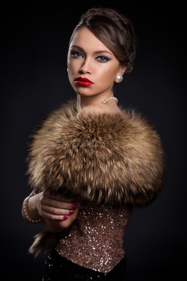 Retro. Beautiful, attractive woman wearing fur